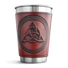 Red leather-bound cup with Celtic knot design on a white background