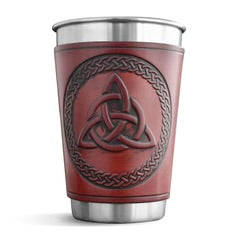 Red leather-bound cup with Celtic knot design on a white background