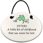 Decorative plaque with shamrock design and text about sisters on a white background
