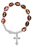 Rosary bracelet with religious images on beads and a cross pendant on a white background