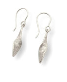Pair of silver leaf-shaped earrings on a white background