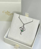 Silver cross pendant with green gemstone in a 'Celtic Heart Gifts' box.