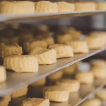 Shelves with rows of corn on a blurred background