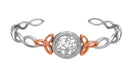 Two-tone  bracelet with intricate design on a white background