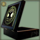Decorative wood box with a tree of life green design on a light green background