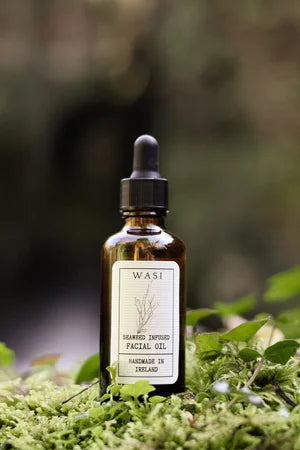 Bottle of Wasi skincare oil on a natural background