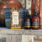 Handcare gift set with bottles and packaging on a wooden surface