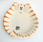 Ceramic plate designed like a cat with orange stripes on a white background